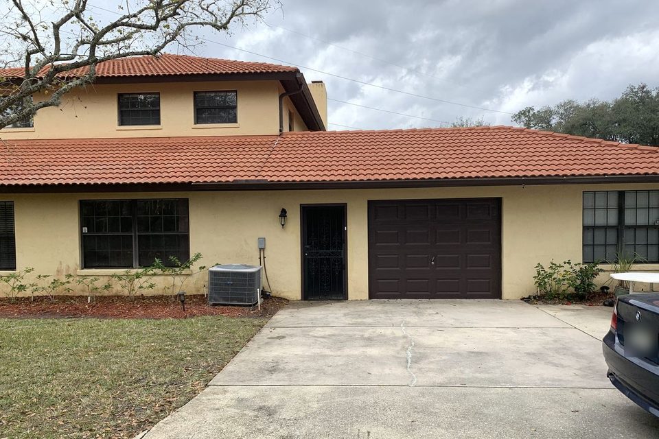 The same house after the roof and driveway were cleaned