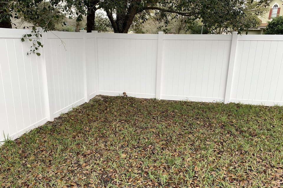 The same vinyl fence after a soft wash