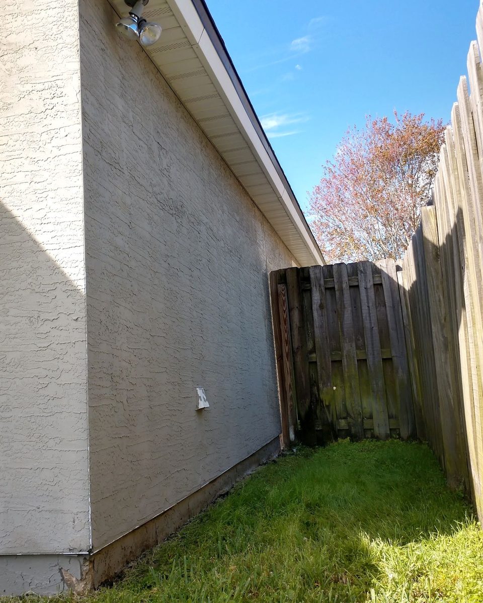 The same stucco wall after a soft wash