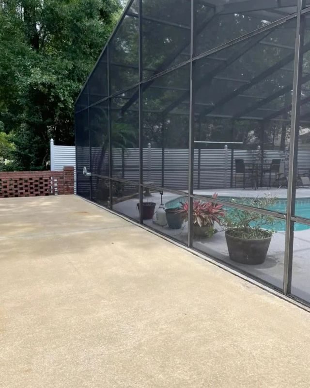 The same screen enclosure and patio after cleaning, the screens clear again